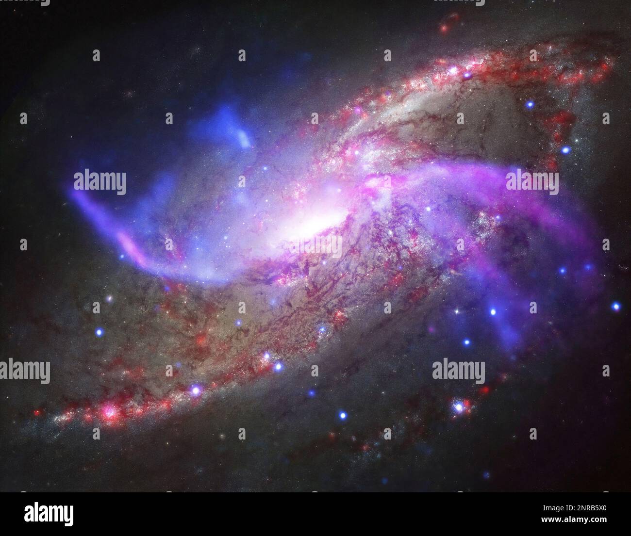 Glowing Galaxy with Anomalous Extra Arms Captured in Space Photo