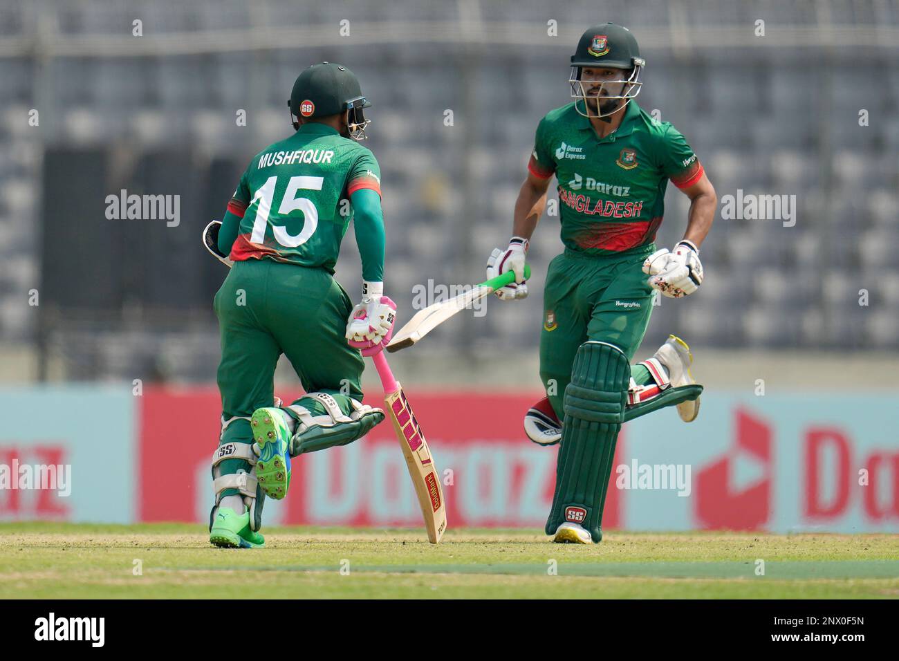 Bangladesh's Najmul Hossain Shanto, right, and Mushfiqur Rahim run between  the wickets to score during the first one day international cricket match  between Bangladesh and England in Dhaka, Bangladesh, Wednesday, March 1,