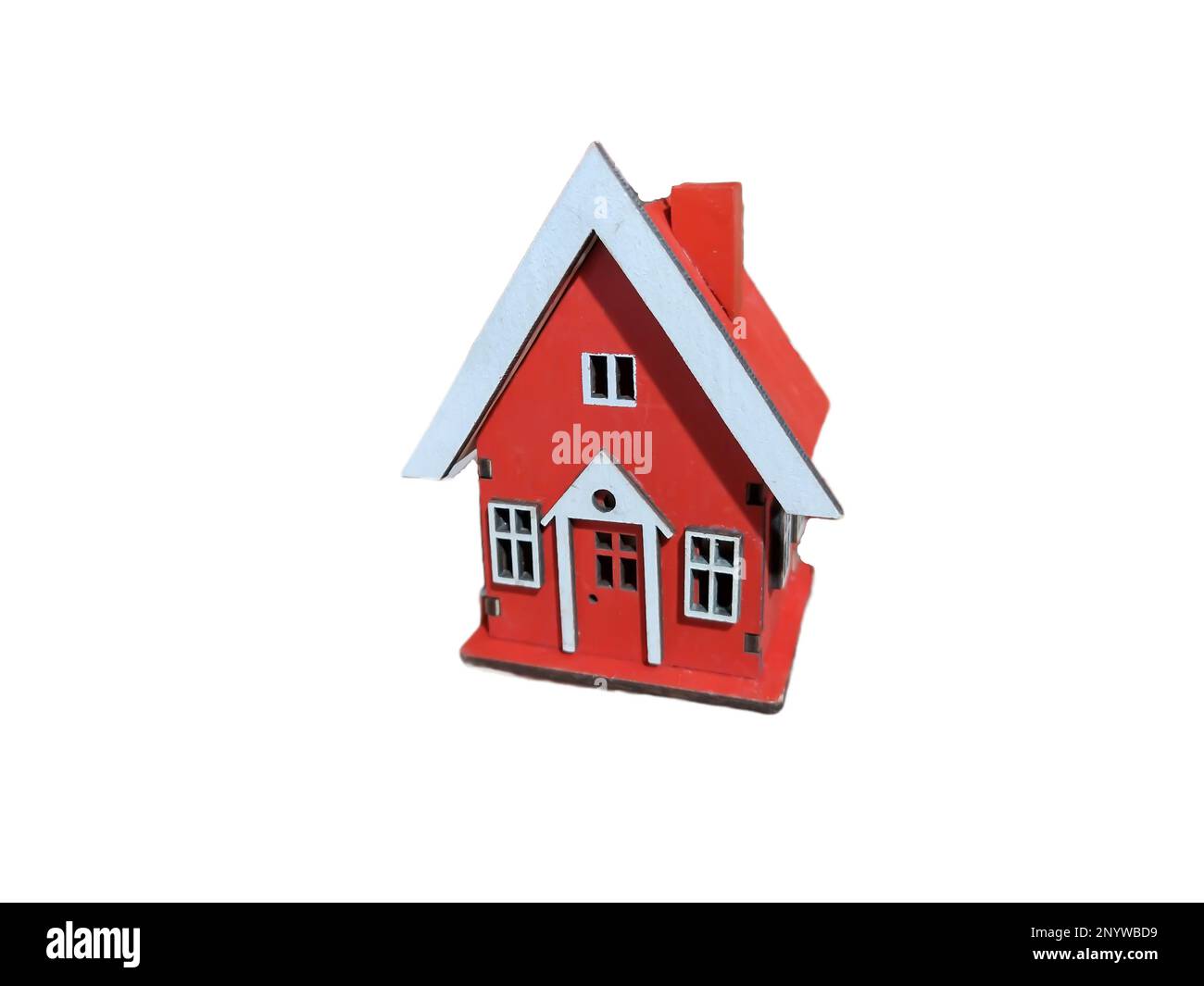 Casa in miniatura isolata su bianco. Concetto di vendita di una casa, immobiliare. Mercato dell'immobilità. Commercio di beni Foto Stock