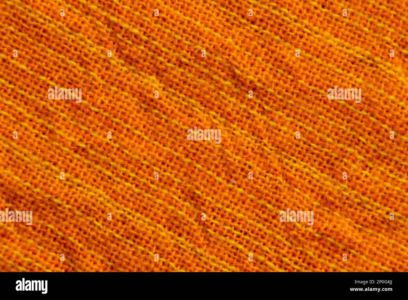 tessuto arancione brillante come macro di sfondo Foto Stock