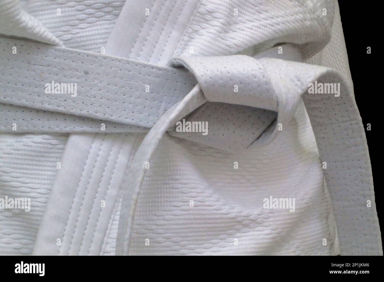 Primo piano su una cintura bianca legata intorno a un kimono. Foto Stock