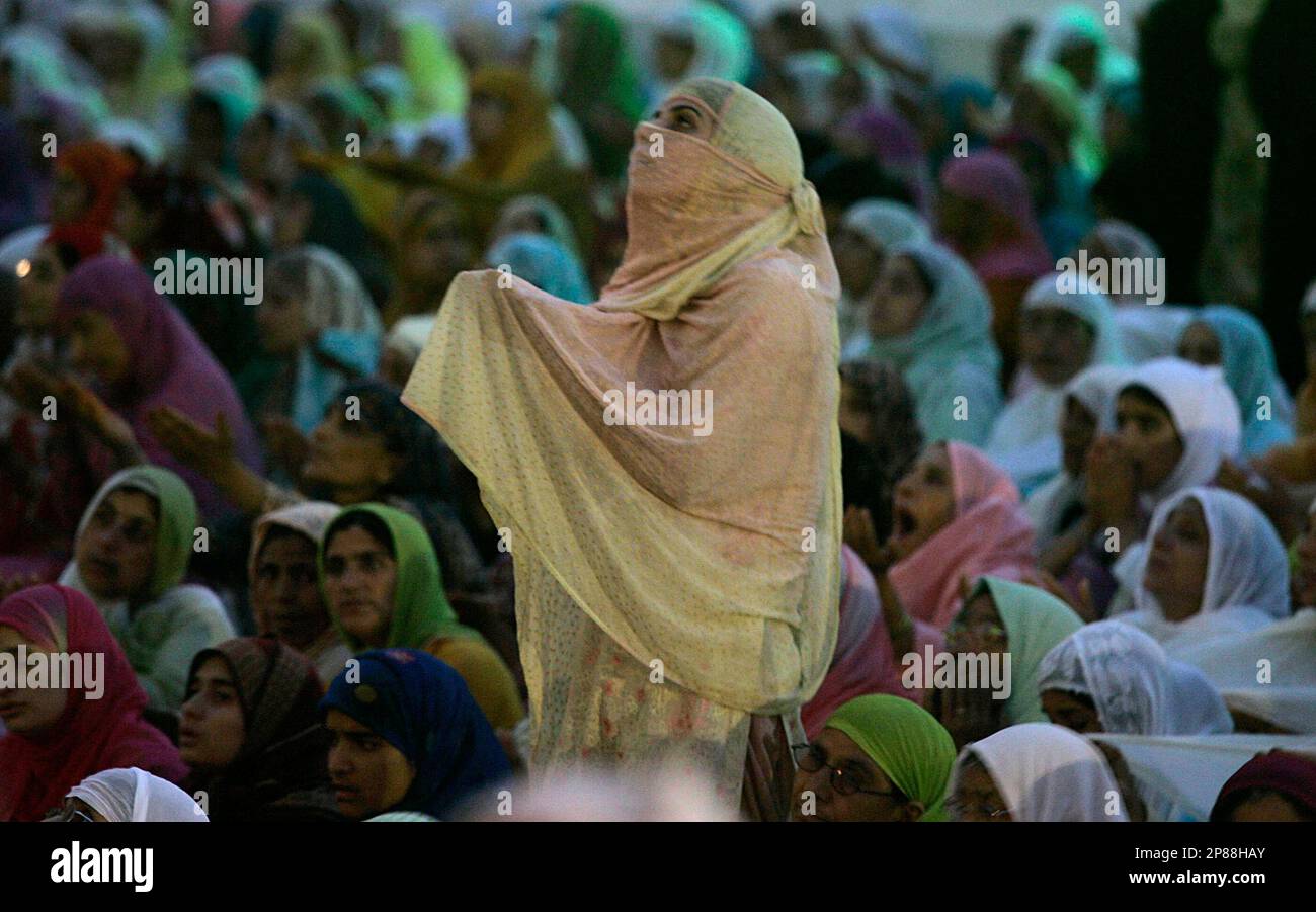 Kashmiri Muslim women look on during special prayers at the Islamic ...