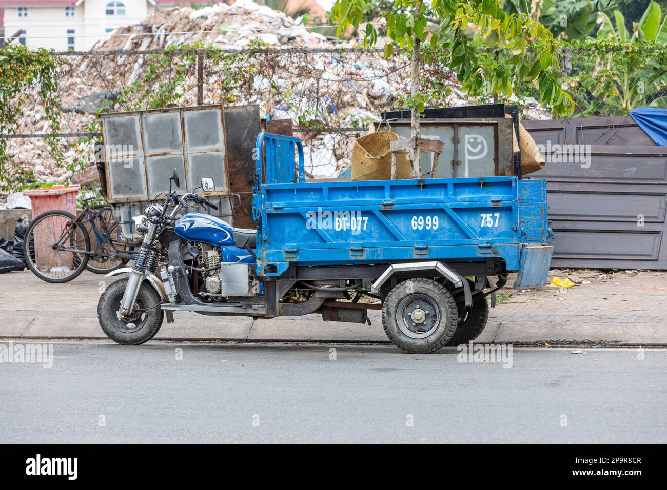 Un portavalute per motociclette a tre ruote a ho Chi Minh City, Vietnam. Foto Stock