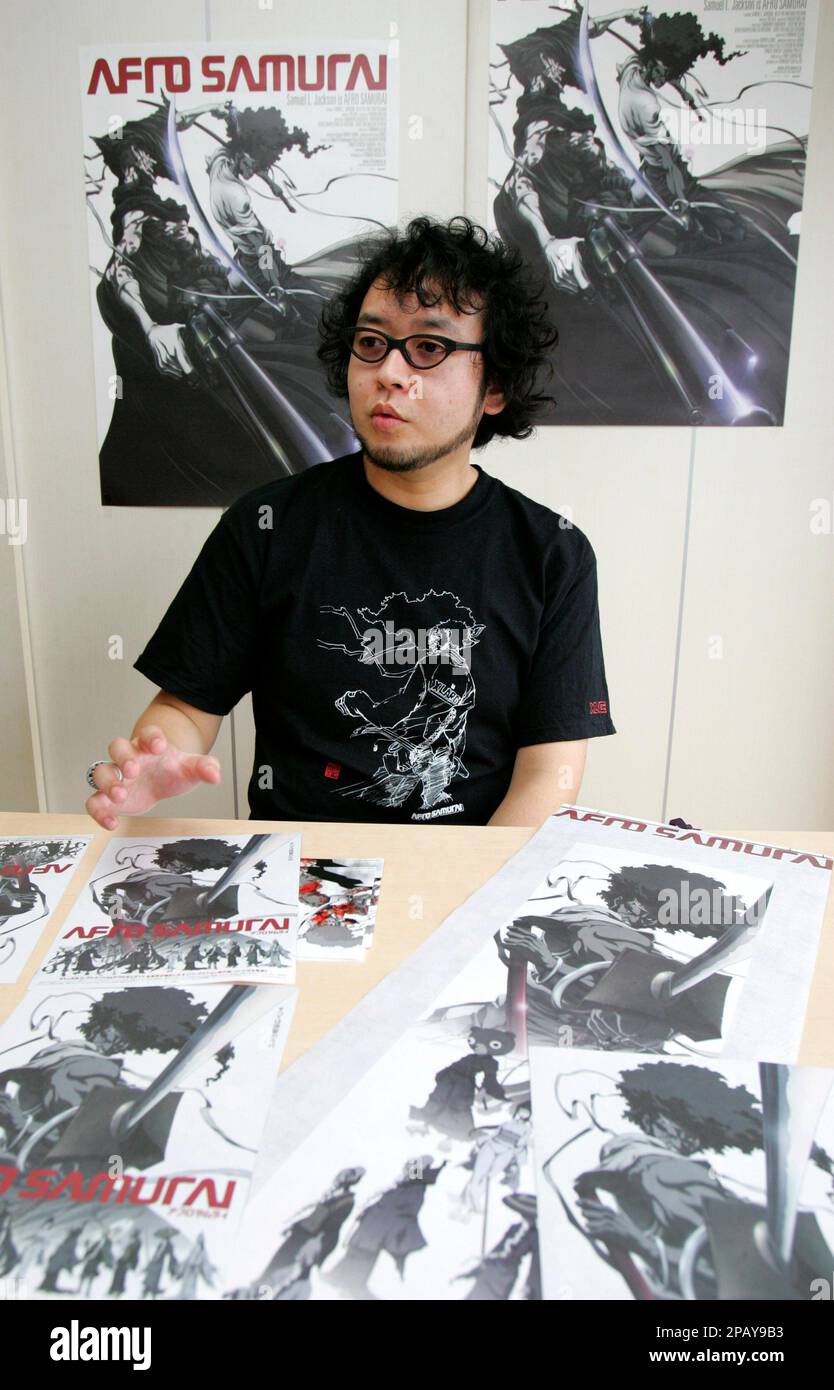 Surrounded by posters of his creation "Afro Samurai," the star of an animation series of the same name featuring Samuel L. Jackson, creator Takashi Okazaki speaks during an interview in Tokyo Tuesday, Oct. 16, 2007. "Afro Samurai" is headed for a second run on U.S. network Spike TV, and finally winning a following in its native Japan where it will debut on the big screen in late October. (AP Photo/Koji Sasahara) Foto Stock