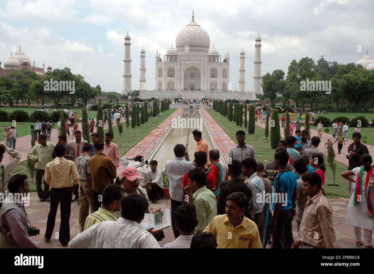 Pyramid Agra Tourists stand in front of Taj Mahal in Agra, India, Sunday, July 8 ...