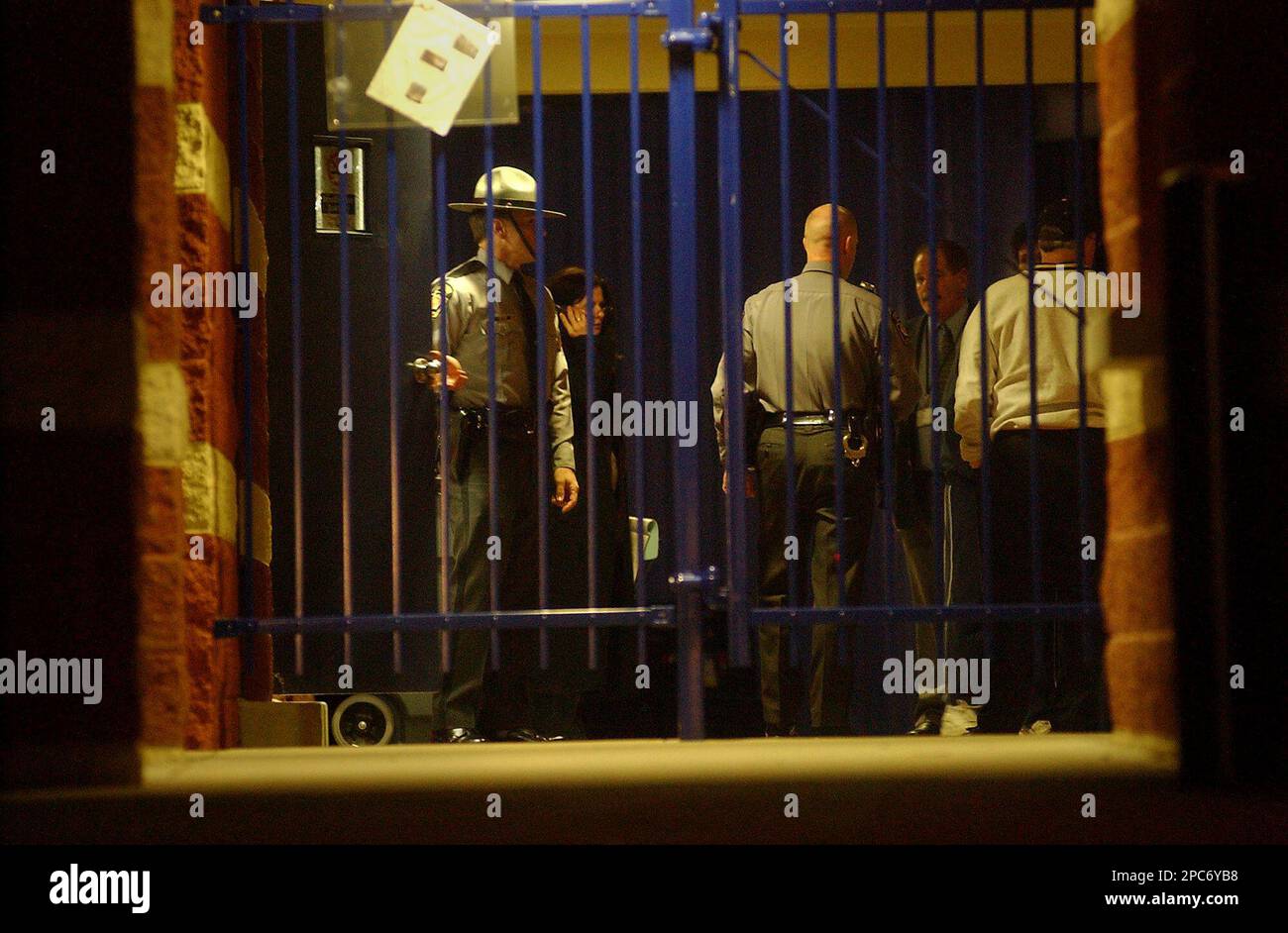 Pennsylvania State Police troopers and McGuffey School District employees gather near McGuffey High School's shooting range Thursday, Dec. 14, 2006, in Claysville, Pa., where a student was found shot. The 17-year-old member of the high school rifle team was found shot in the school stadium's locker room and authorities were investigating whether the boy's death was an accident or a suicide. The boy was taken to UPMC Presbyterian Hospital where he died Friday. (AP Photo/Observer-Reporter, Greg Tarr) Foto Stock