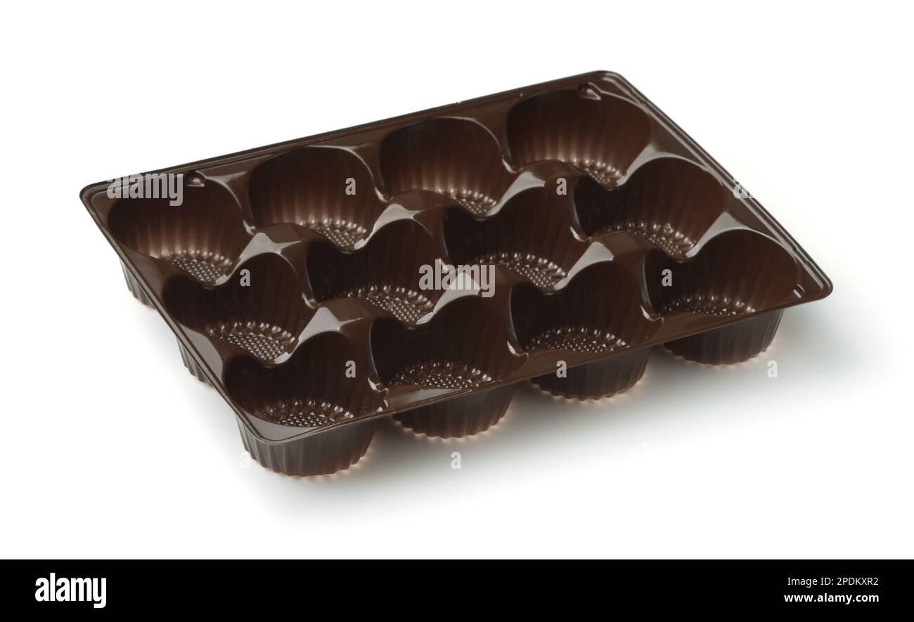 Vassoio vuoto per confezione di caramelle in blister di plastica marrone isolato su bianco Foto Stock