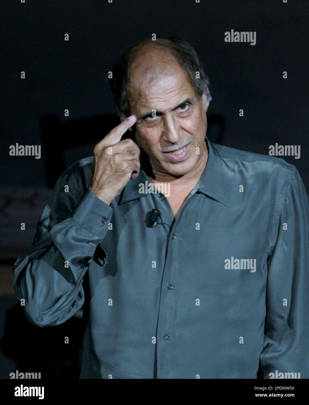 Adriano Celentano gestures during his monologue at the 'Rockpolitick' Rai tv  show, in Brugherio, northern Italy, Thursday, Oct. 20, 2005. The famous  Italian rockstar and actor caused a media stir with his