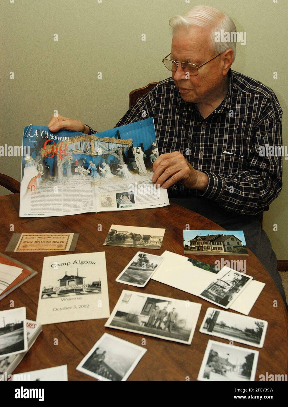 Eldred Harman, 83, of Waterloo, Iowa, shows May 26, 2004, a magazine
