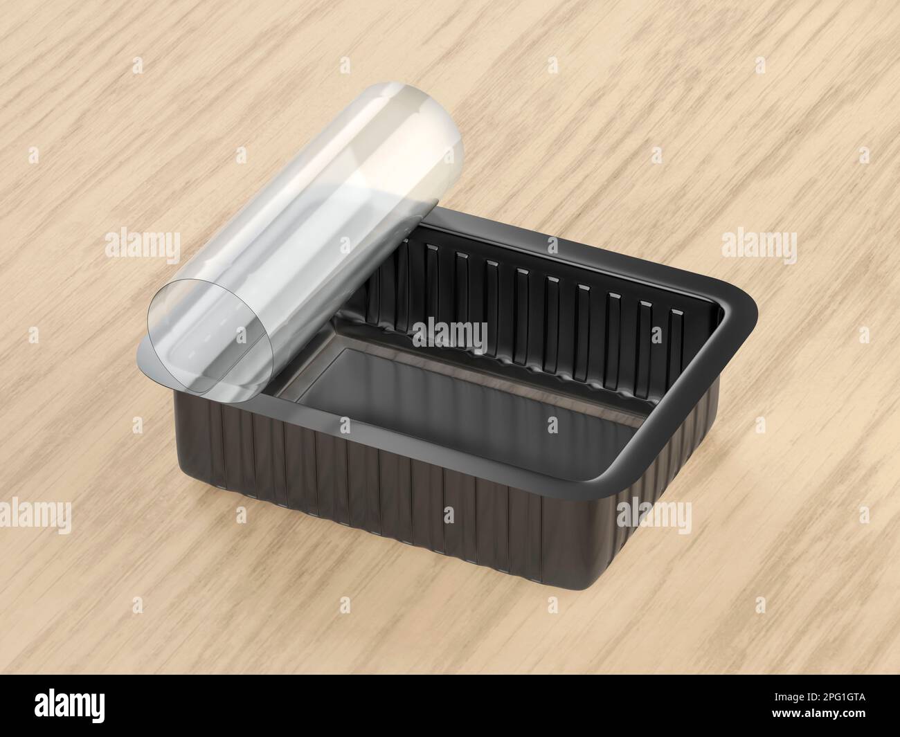 Aprire il contenitore di plastica per alimenti su un tavolo di legno Foto Stock