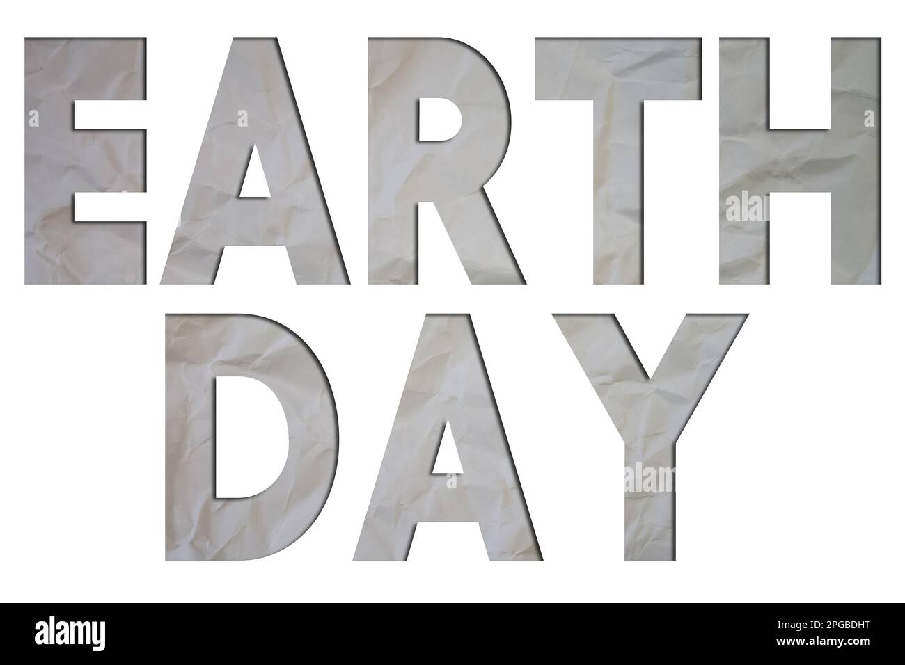 Testo della Giornata della Terra con un Libro bianco strappato e stropicciato su sfondo colorato. Foto Stock