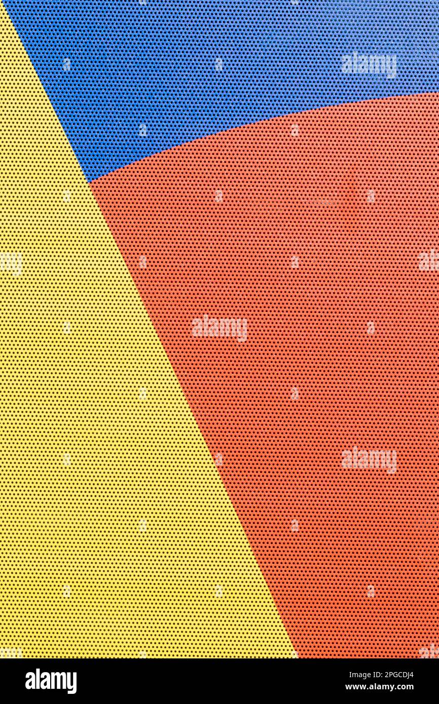 Astratto di giallo, blu e rosso con una trama di punti neri. Foto Stock