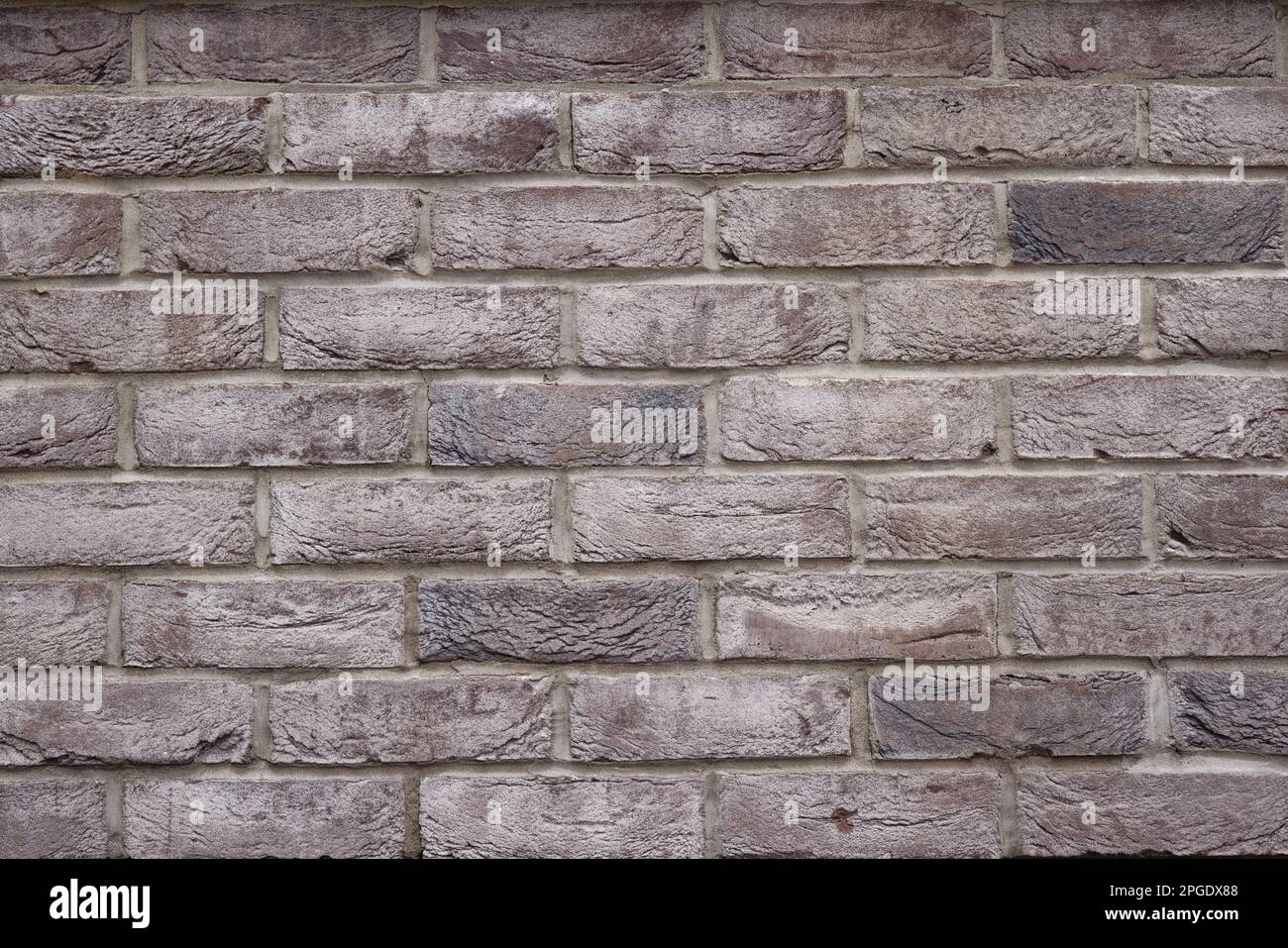 Muro di mattoni grigio Foto Stock