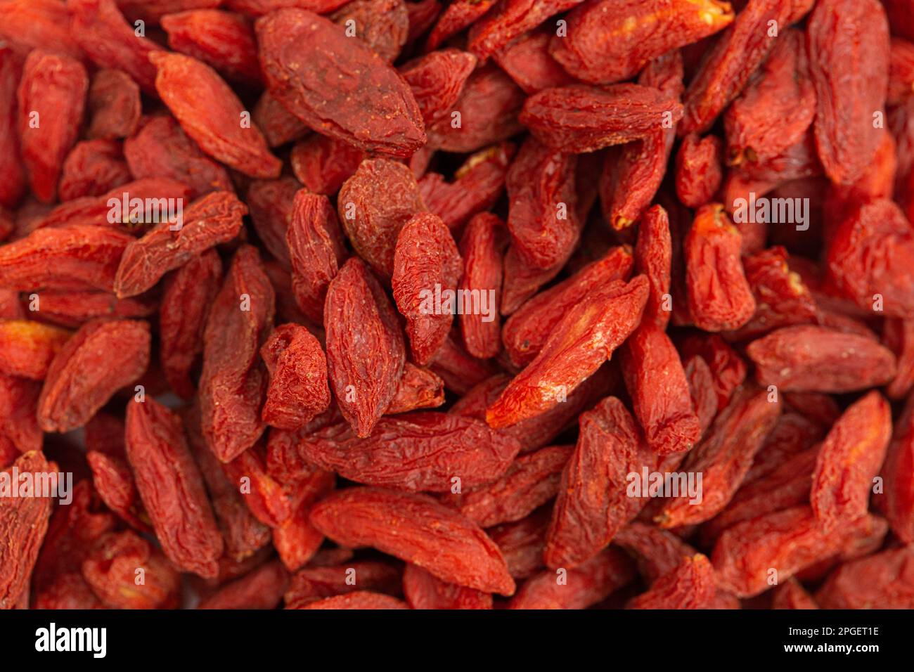 Fondo di bacche secche di Goji rosse disidratate Foto Stock