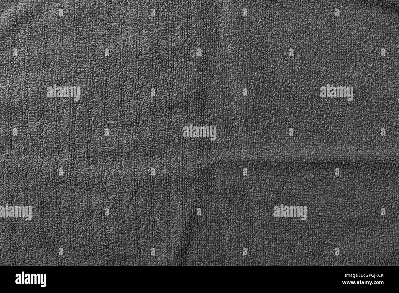 Tessuto in spugna grigio. Sfondo tessile, vista dall'alto Foto Stock