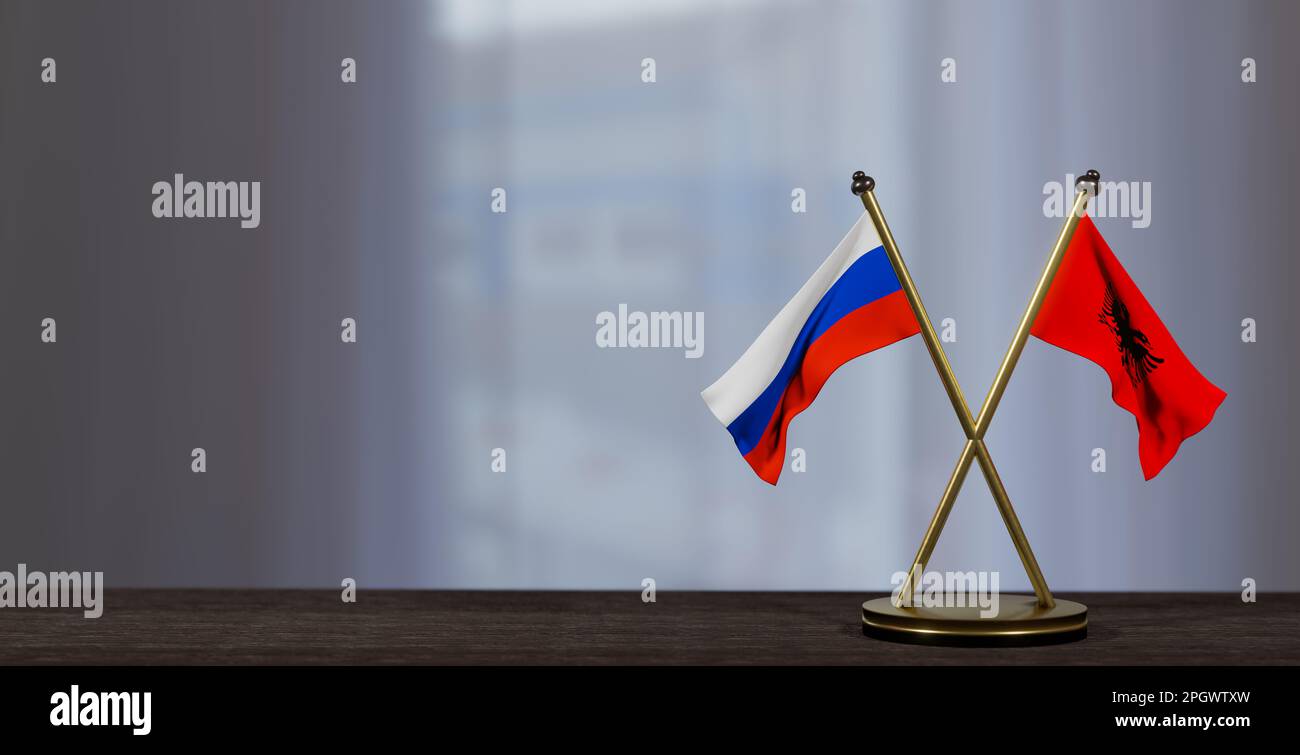 Bandiere di Russia e Albania sul tavolo. Negoziati tra Albania e Russia. su sfondo poco sfocato. 3D lavoro e 3D immagine Foto Stock
