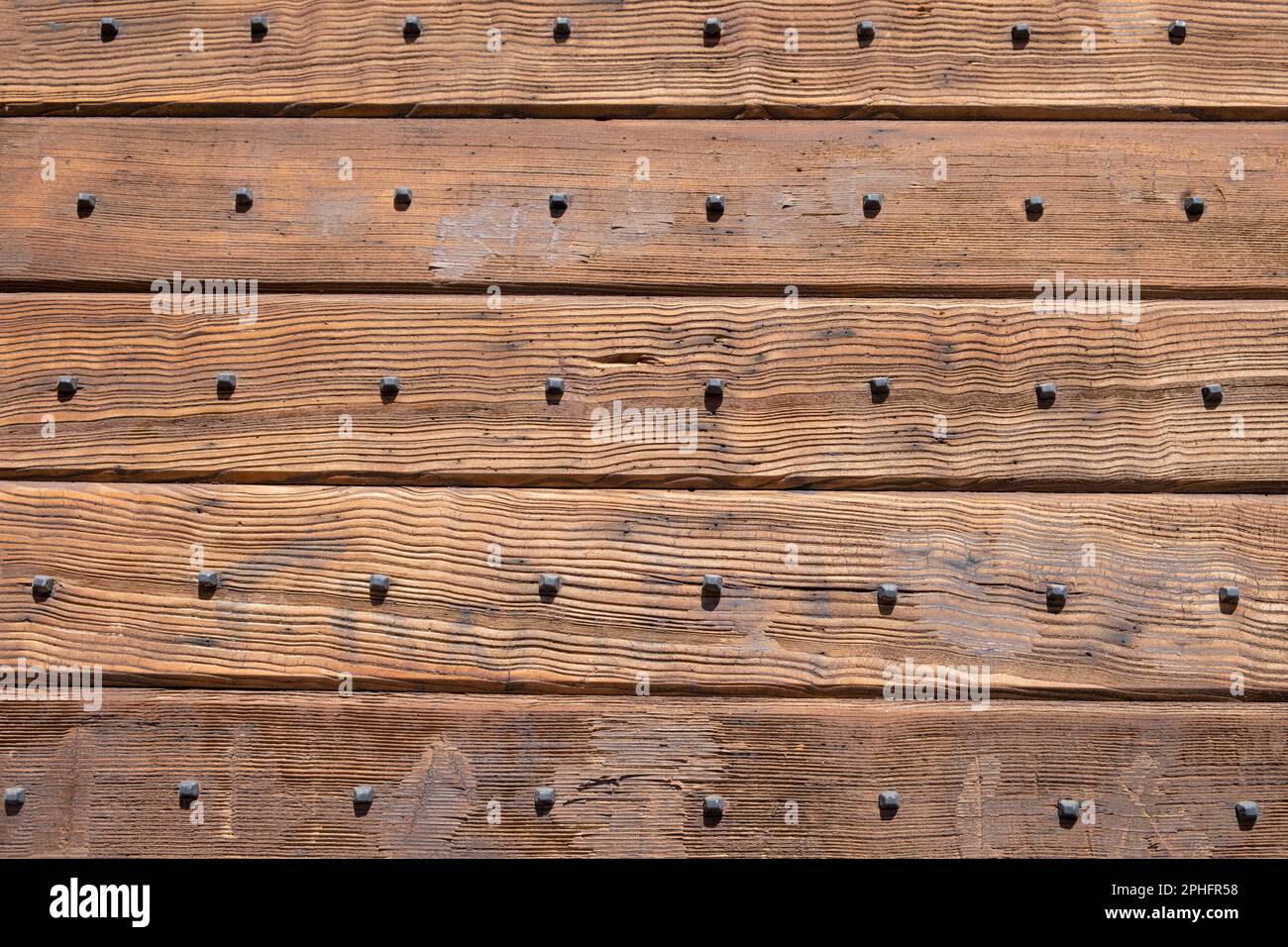 Sfondo di legno, texture. Tavole di legno con decorazione unghie, sfondo rustico vintage Foto Stock