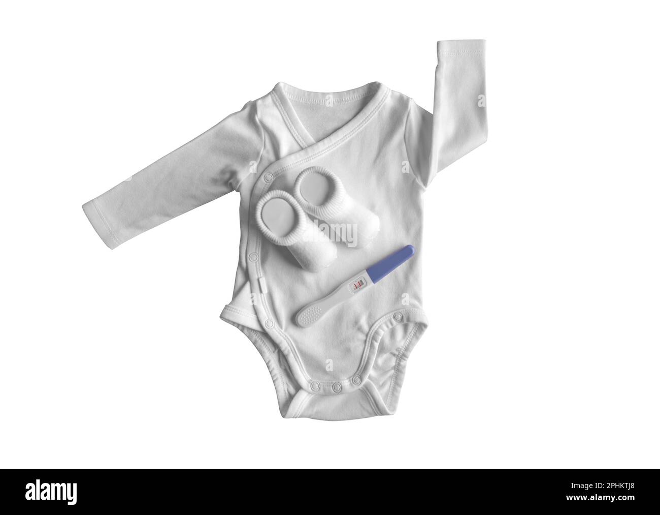 Test di gravidanza e vestiti per bambini. Foto Stock