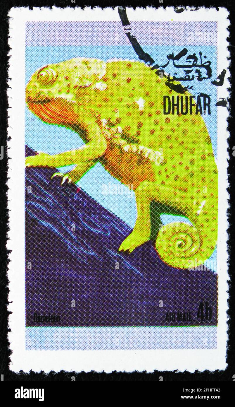 MOSCA, RUSSIA - 25 MARZO 2023: Francobollo stampato a Dhufar mostra Chameleon, rettili serie, circa 1972 Foto Stock