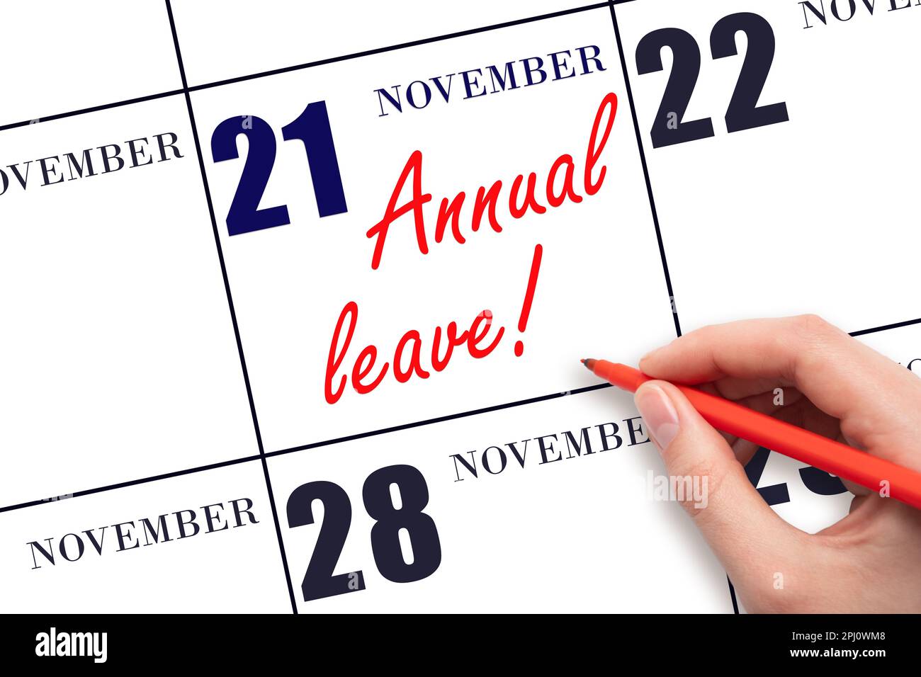 21st° giorno di novembre. Scrivere a mano il testo CONGEDO ANNUALE e disegnare il sole sulla data di calendario 21 novembre. Salvare la data. Tempo per le vacanze. v Foto Stock