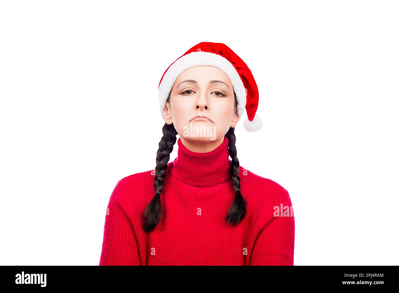 Offesa insoddisfatta ragazza di Natale a Santa Hat isolato su uno sfondo bianco. Foto Stock