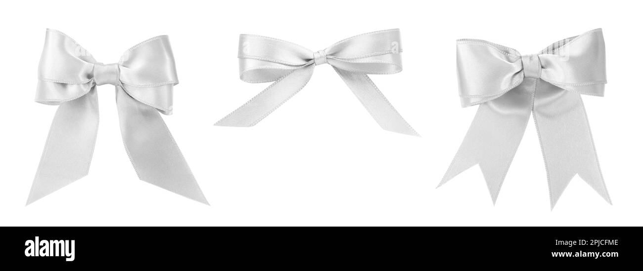 Set con belle archi in argento su sfondo bianco. Design del banner Foto Stock