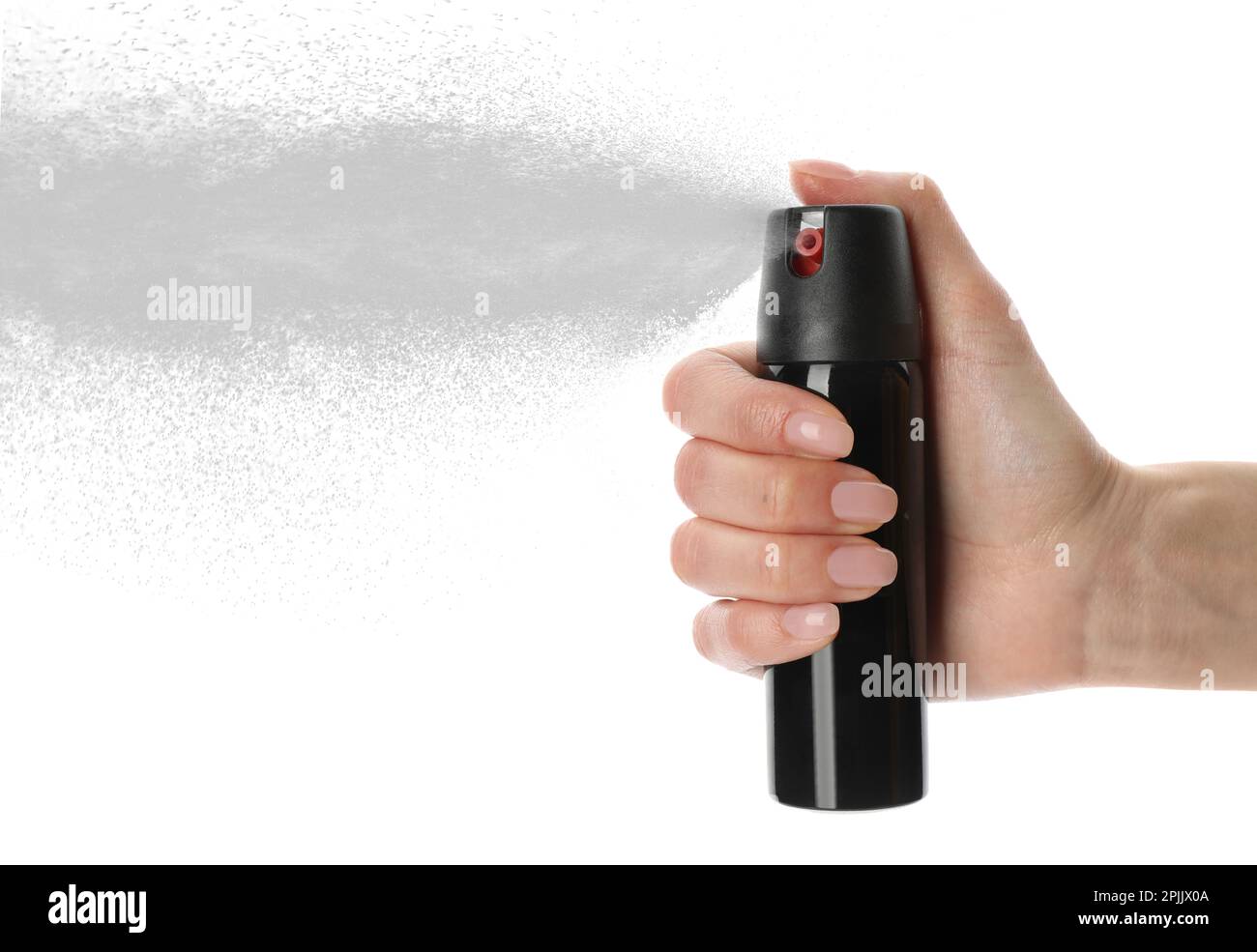 Donna con pepe spray su sfondo bianco, primo piano Foto Stock