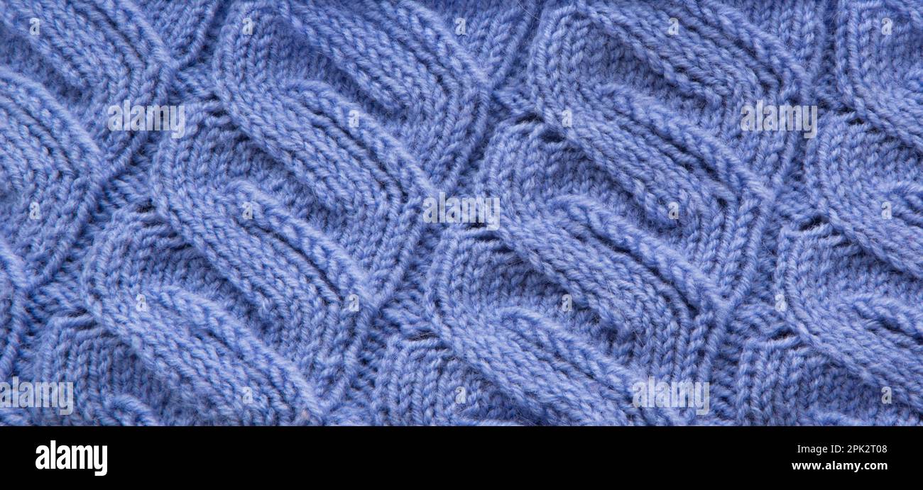 Unisci ripetizione. Primo piano della tessitura di lana lavorata a maglia. Colore del motivo a maglia come sfondo. Foto Stock