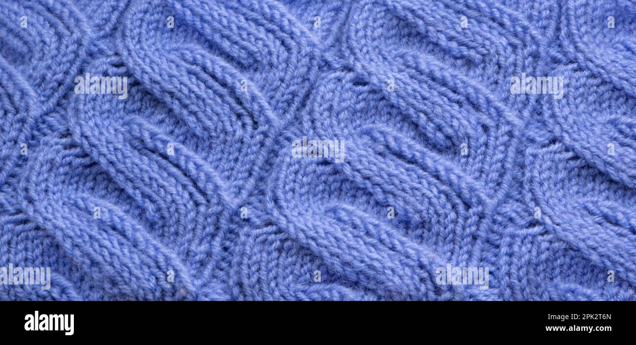 Unisci ripetizione. Primo piano della tessitura di lana lavorata a maglia. Colore del motivo a maglia come sfondo. Foto Stock