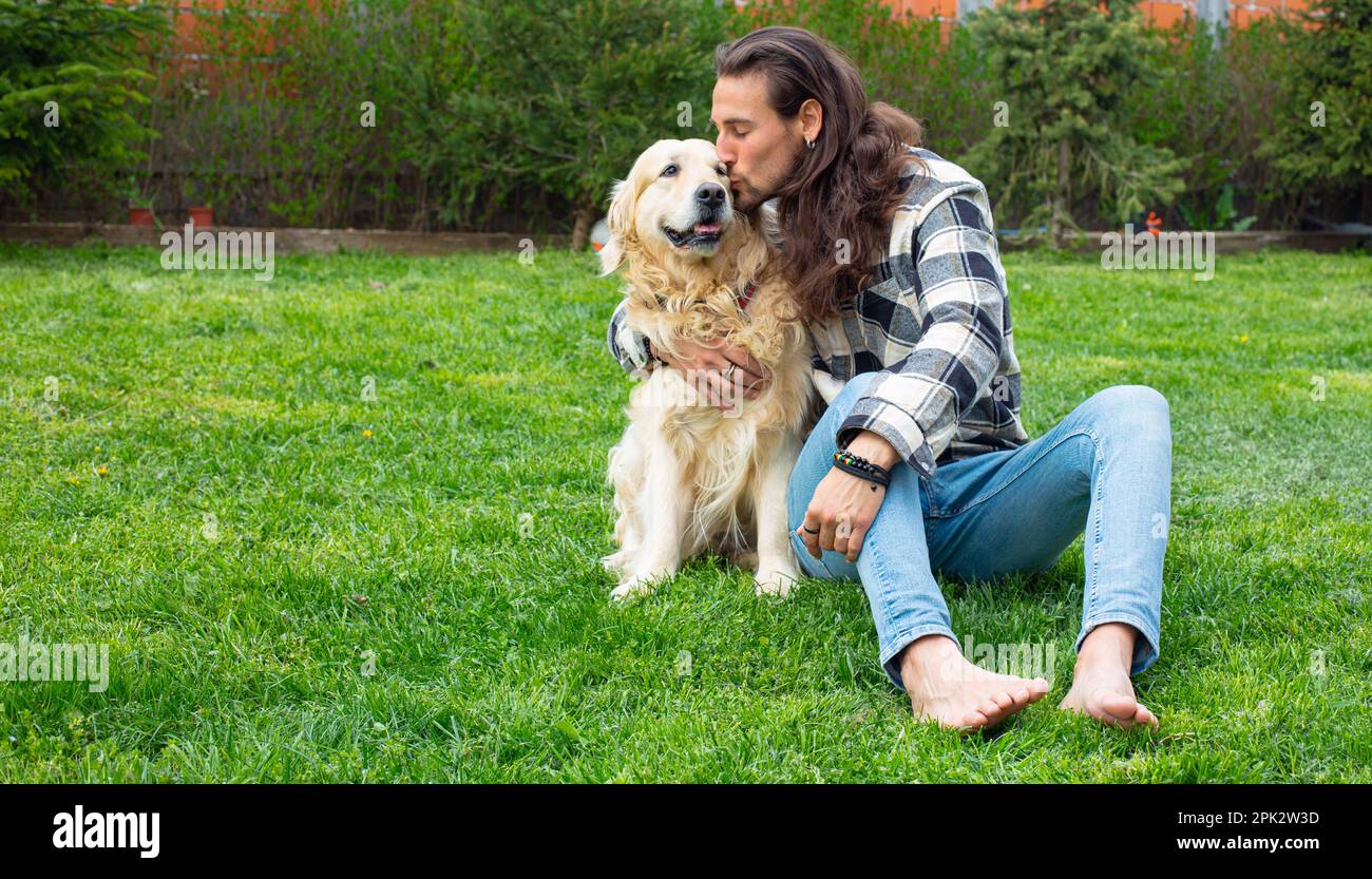 Golden Retriever e proprietario Foto Stock