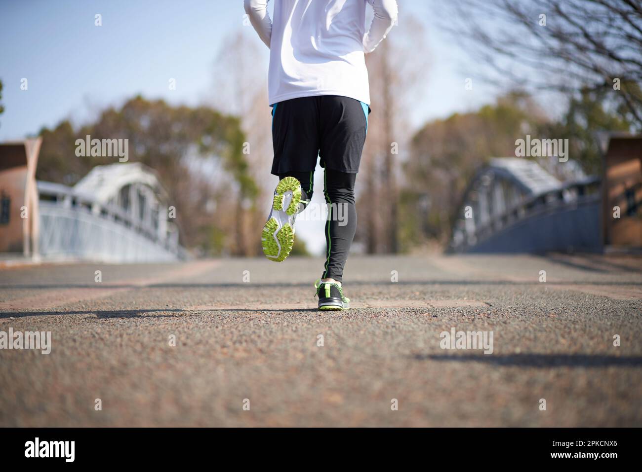 Running Man's Back Foto Stock