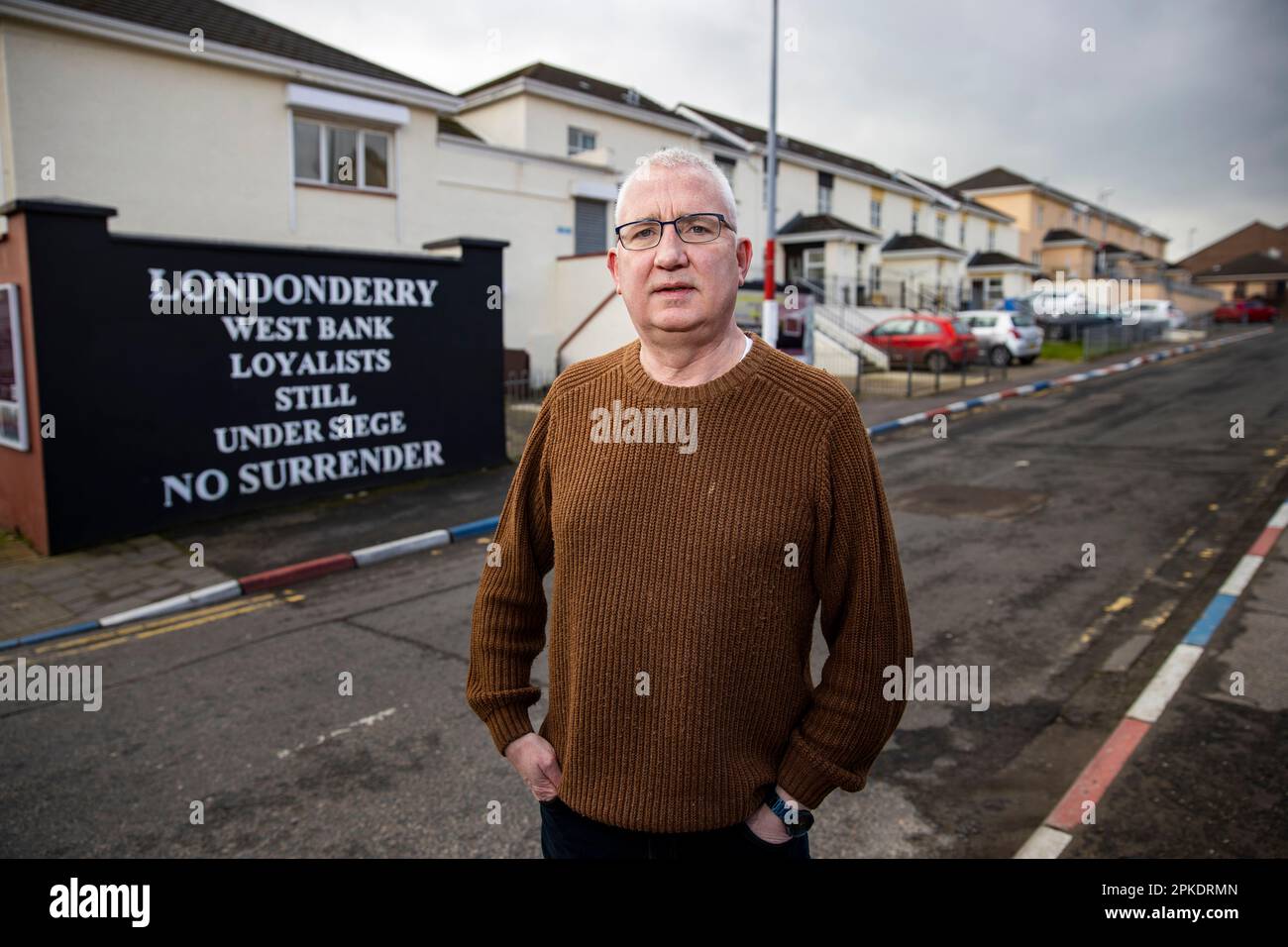 Brian Dougherty, collaboratore della comunità sindacalista, nella zona delle fontane di Derry City a Londonderry. Foto Stock