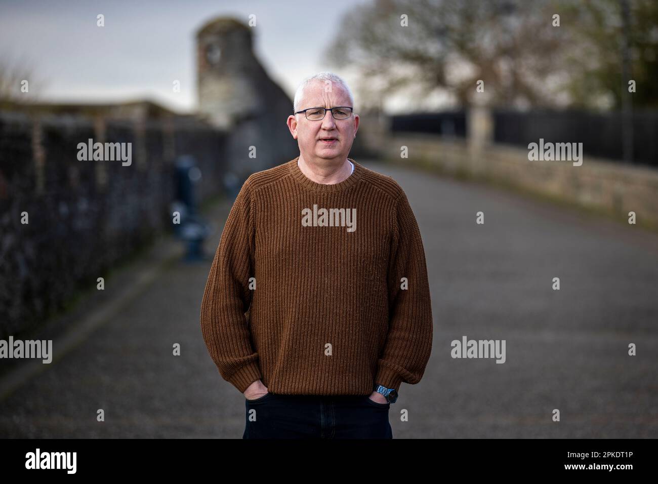 Brian Dougherty, collaboratore della comunità sindacalista, nella zona delle fontane di Derry City a Londonderry. Foto Stock