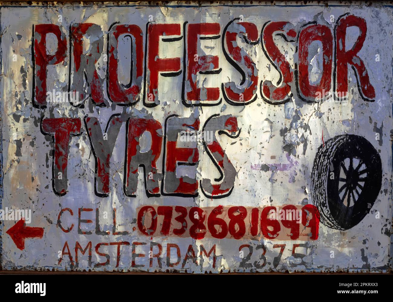Il nome di un'azienda di riparazione pneumatici nel villaggio di Amsterdam. Foto Stock
