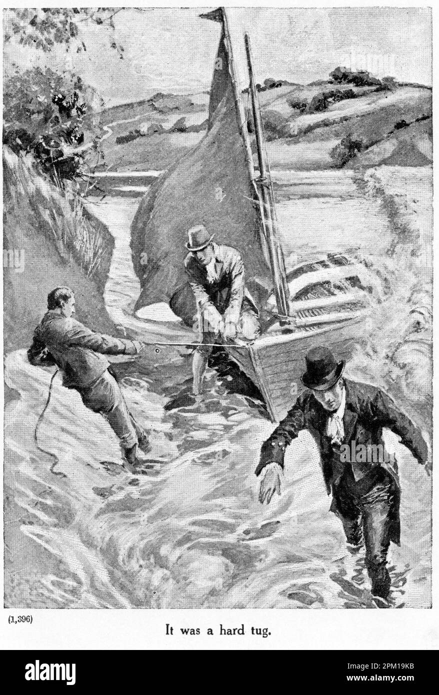 Un uomo tira a riva una piccola imbarcazione a vela mentre i passeggeri camminano a riva. Foto Stock