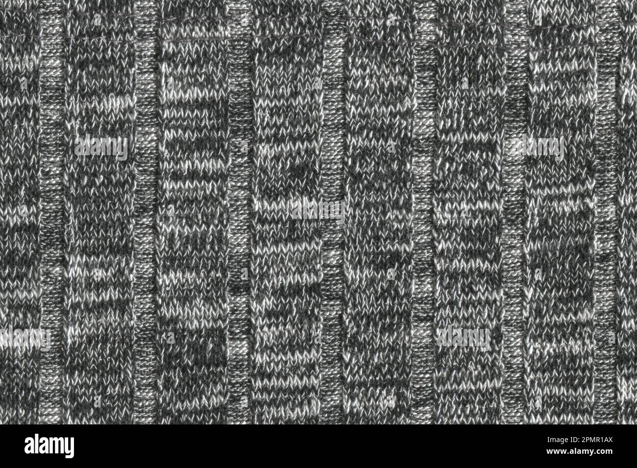 La trama di una lana di maglia grigio e bianco. maglia texture. sfondo Foto Stock