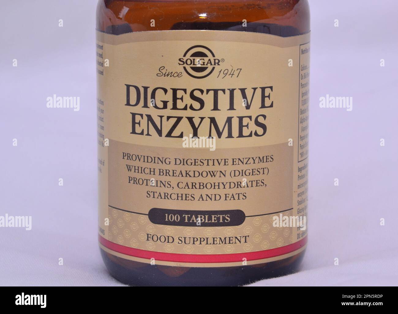 Immagine di scorta foto di una bottiglia di enzimi digestivi con un'etichetta che dice le compresse 'ripartizione o digerire proteine, carboidrati, amidi e grassi'. Foto Stock