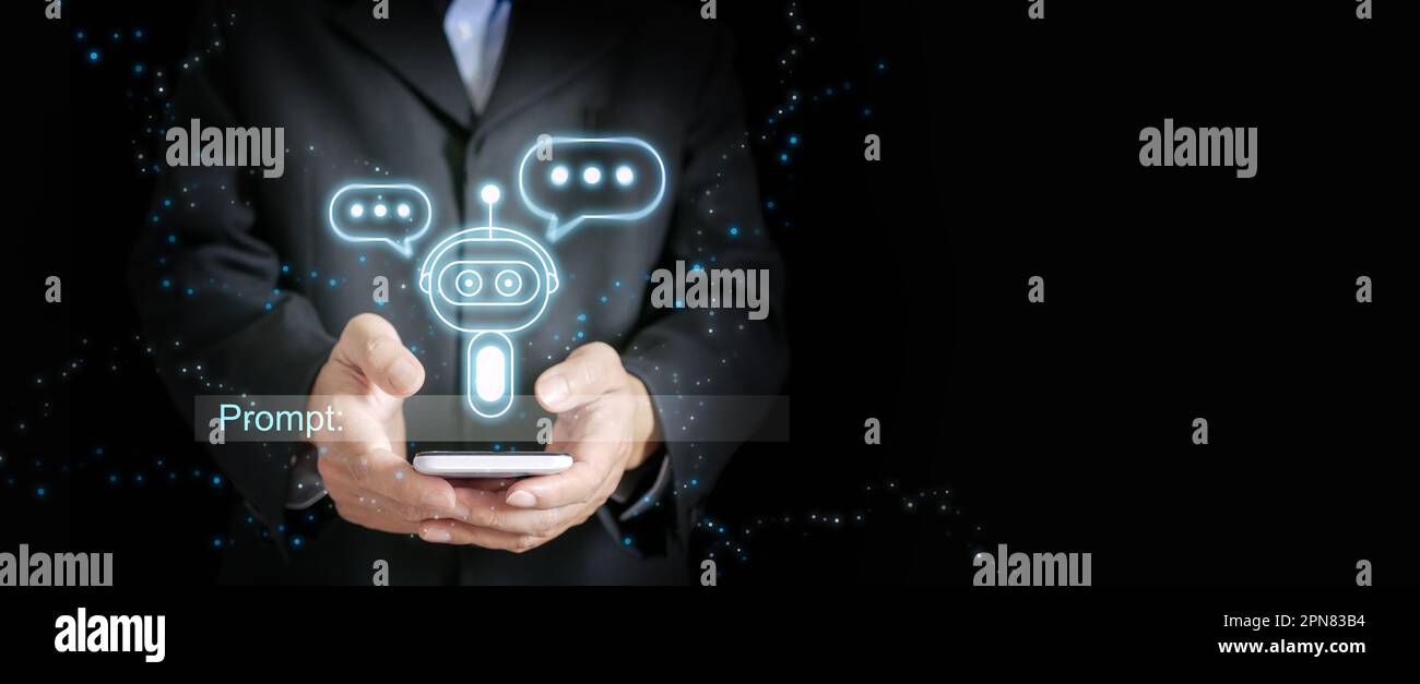 Chatbot in mano a un uomo d'affari con una casella di immissione di testo pronta a raccogliere il prompt o gli input degli utenti. Foto Stock