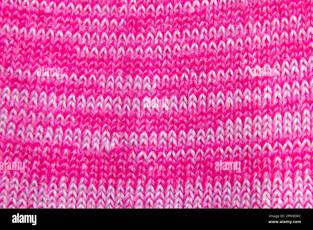 i maglioni in tessuto a maglia rosa chiaro si vestono come sfondo Foto Stock