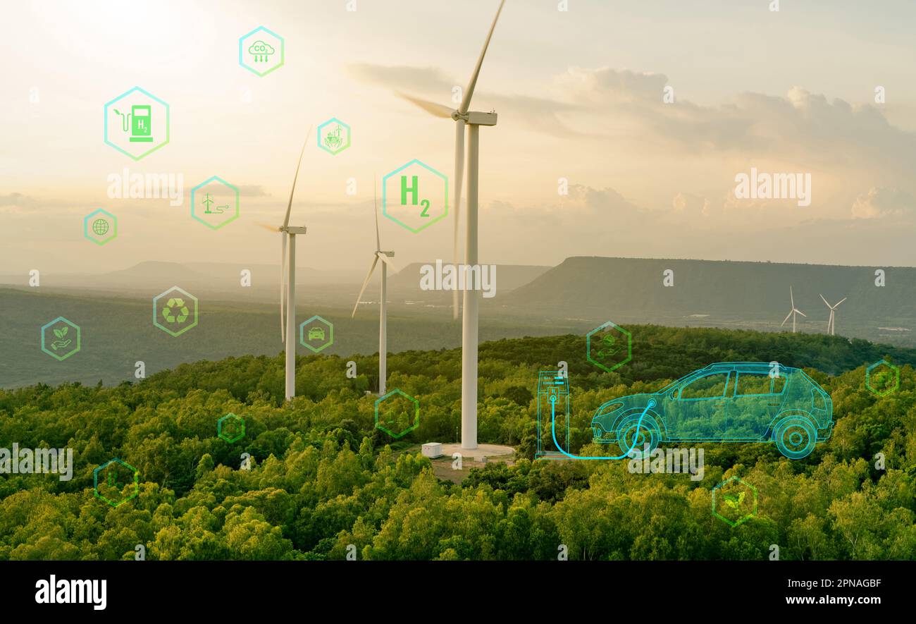Produzione di gas di idrogeno verde presso la fattoria eolica. Energia rinnovabile sostenibile. Rifornimento di auto elettrica H2 presso la stazione di rifornimento di idrogeno. H2 veicolo con celle a combustibile. Foto Stock