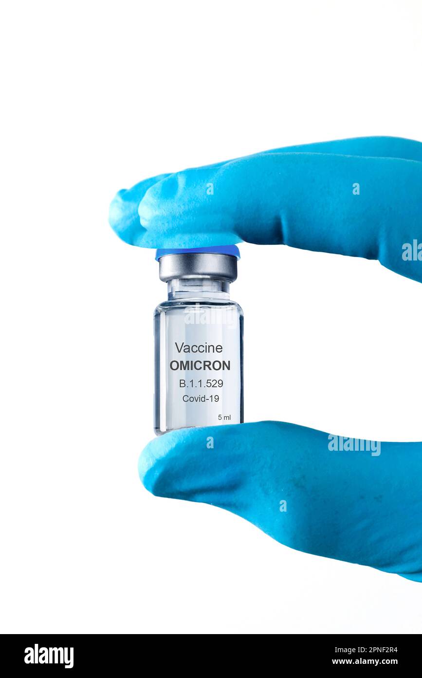 Mano che tiene una fiala con vaccino contro Corona, omicron variante B.1.1.529 Foto Stock