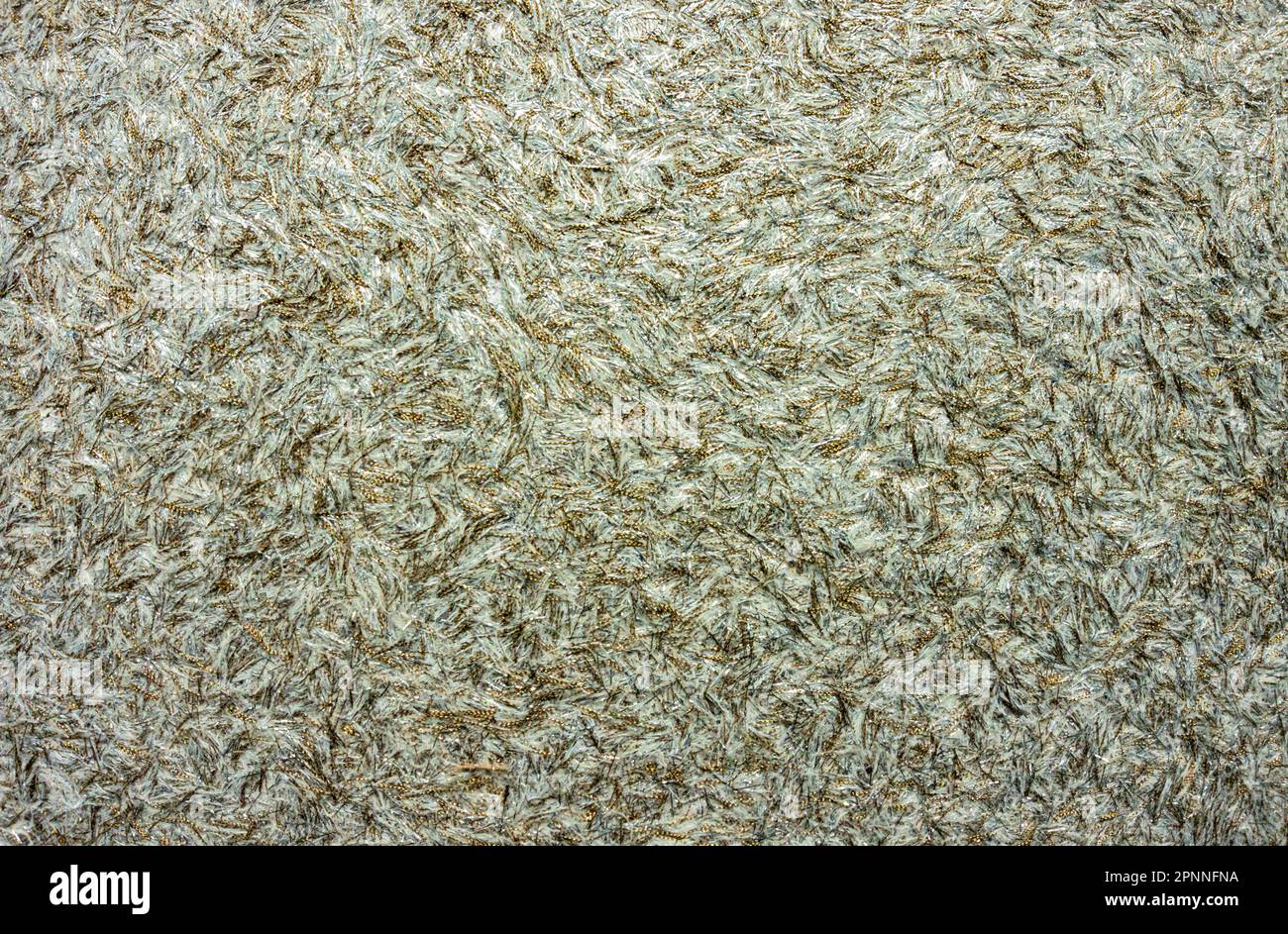 Sfondo astratto con capelli e consistenza morbida. Grigio - verde con una tonalità oro Foto Stock