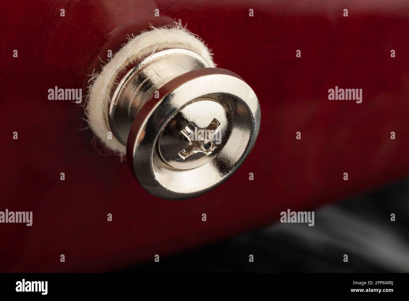 closeup macro bottone cinturino chitarra Foto Stock