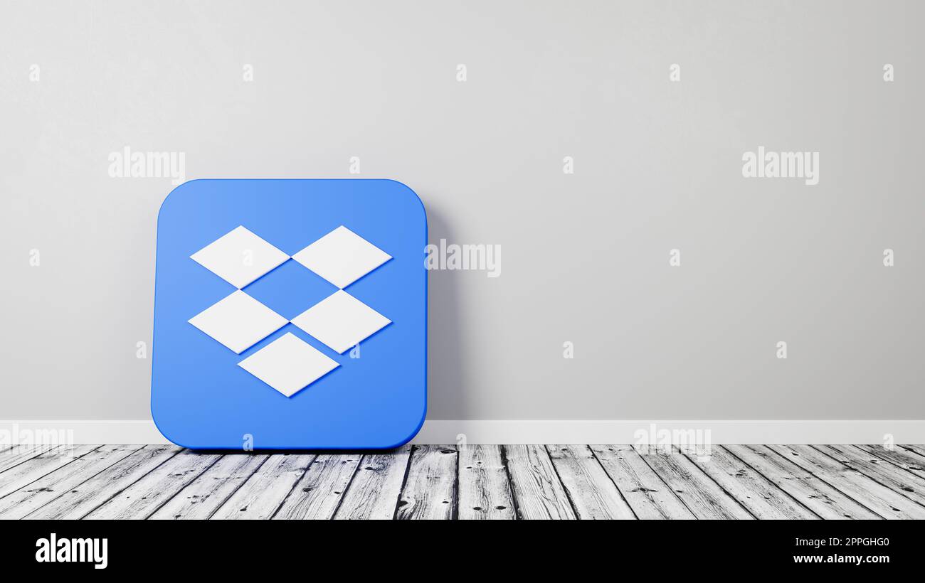 Icona Dropbox App 3D su pavimento in legno contro muro Foto Stock