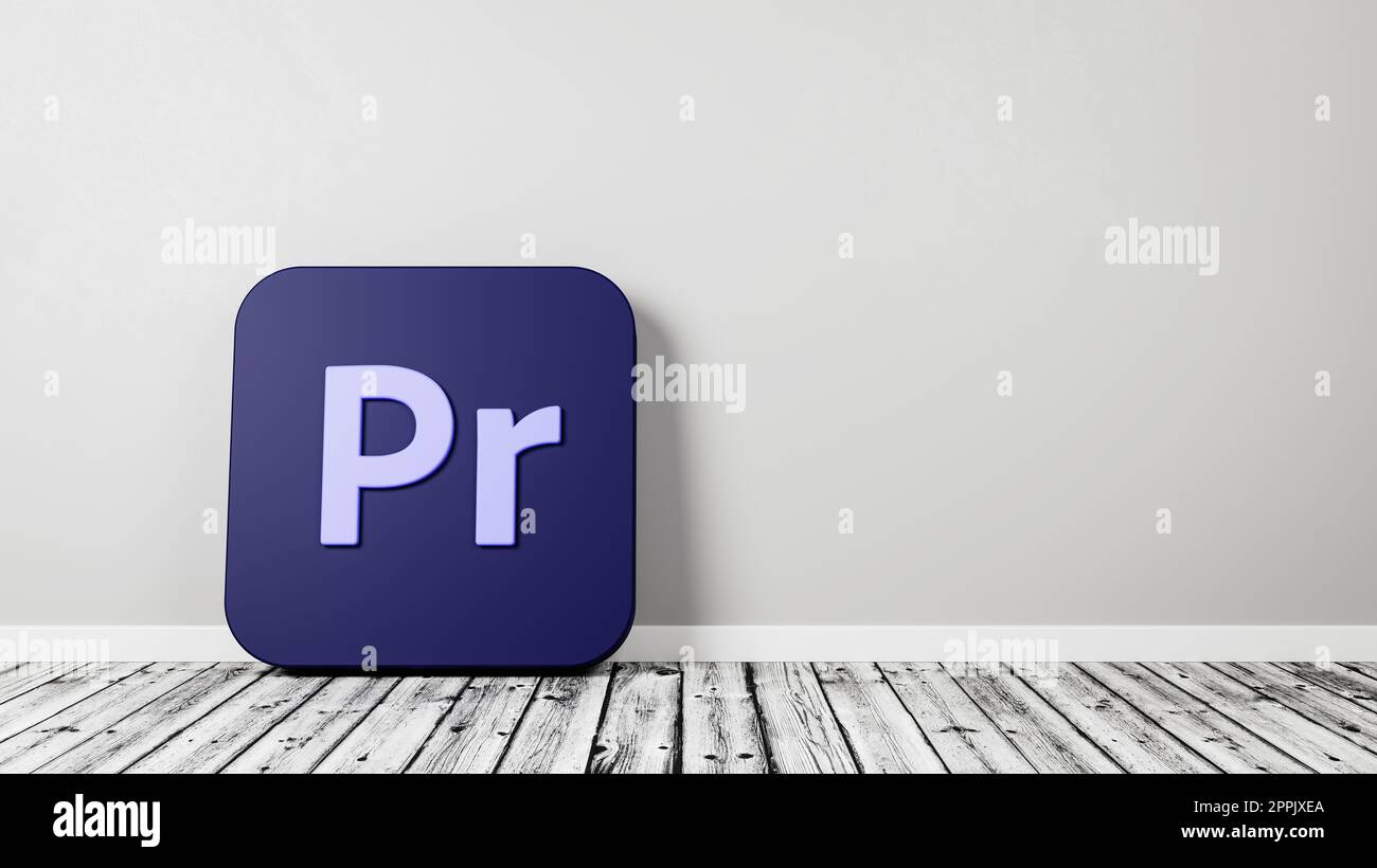 Icona dell'app Adobe Premiere Pro su parquet contro parete Foto Stock