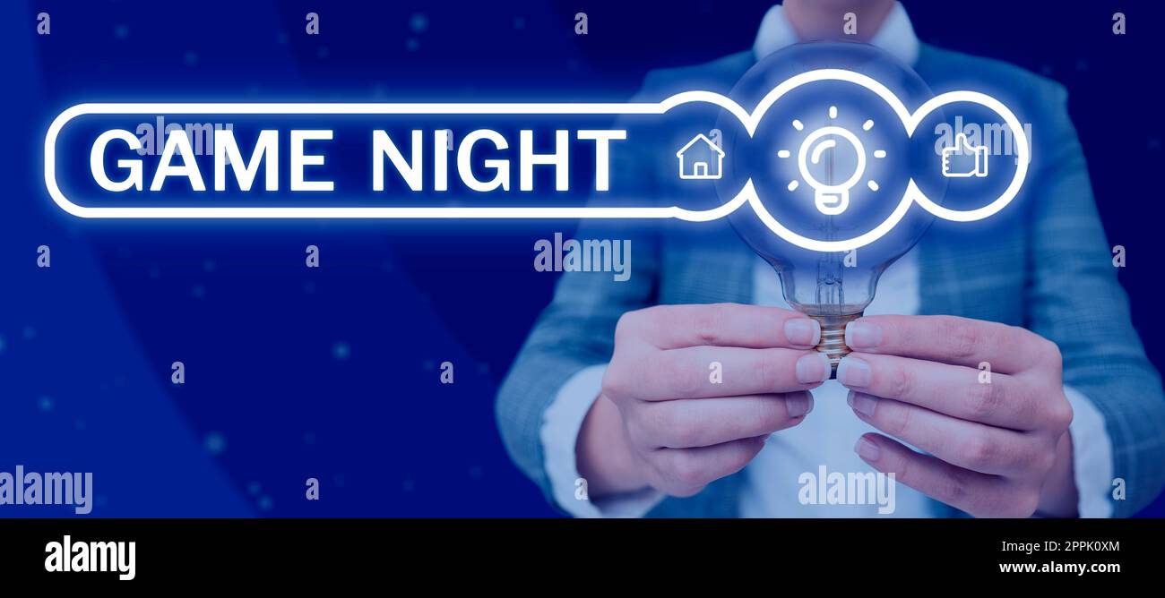 Scrittura a mano segno Game Night. Evento fotografico concettuale in cui le persone si riuniscono allo scopo di ottenere posato Foto Stock