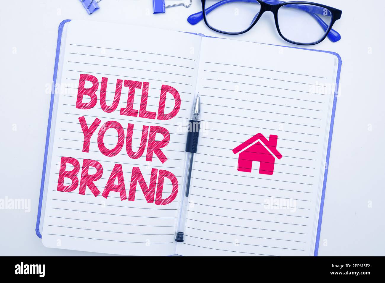 Scrittura a mano segno costruire la vostra marca. Approccio aziendale fare un'identità commerciale Pubblicità di marketing Foto Stock