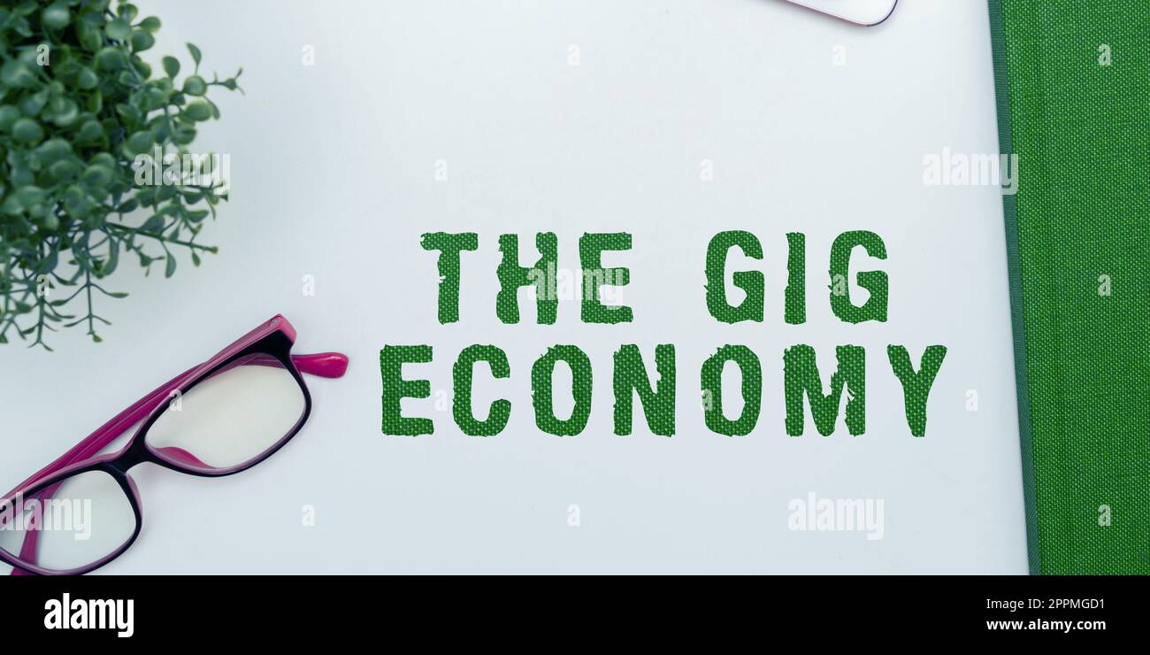 Scrittura visualizzazione testo The Gig Economy. Approccio aziendale mercato dei contratti a breve termine lavoro indipendente temporaneo Foto Stock