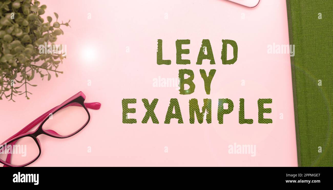 Segno di scrittura a mano piombo per esempio. Concetto di business essere un leader mentore seguire le regole dare esempi Coach Foto Stock