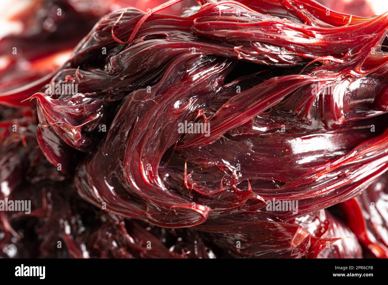 Grasso al litio sintetico rosso eccellente resistente all'acqua per percorsi di movimentazione e lubrificazione di macchinari per il settore automobilistico e industriale. Foto Stock